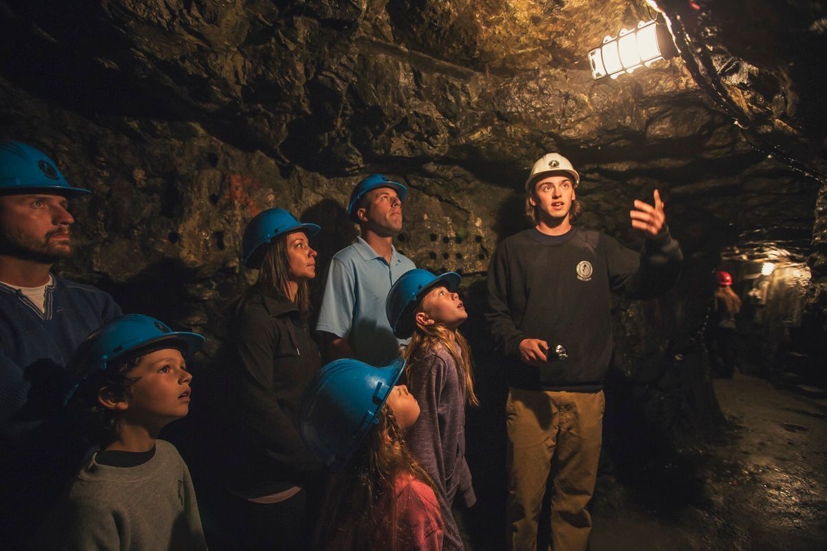 A tour group looks up in a mine.